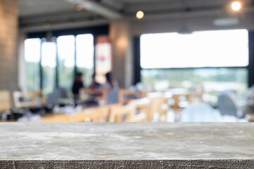 Empty wooden table space platform and blurred restaurant or coffee shop background for product display montage.