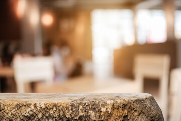 Empty wooden table space platform and blurred resturant or coffee shop background for product display montage.