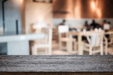 Empty wooden table space platform and blurred restaurant or coffee shop background for product display montage.