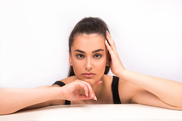 Obraz premium Beauty portrait of young woman with natural look, isolated on white. Nude make up, perfect skin, skin care concept