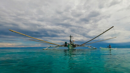Fototapeta premium fishing boat at sea at dawn