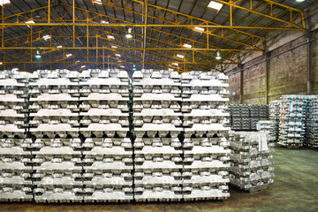 Aluminum ingot bar stack in warehouse for supplying to factory. Distribution warehouse and...