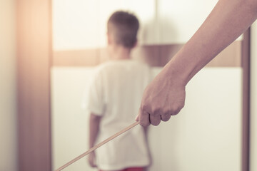 Asian young father hit his son with a wand with concept © Treetree2020
