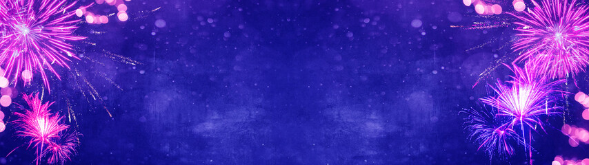 Silvester background banner panorama long- Pink firework and pink bokeh lights on dark blue night...
