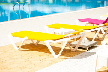 Sun loungers for sunbathing by the outdoor pool