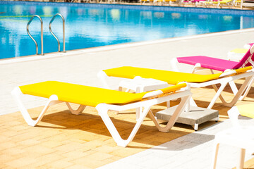 Fototapeta premium Sun loungers for sunbathing by the outdoor pool
