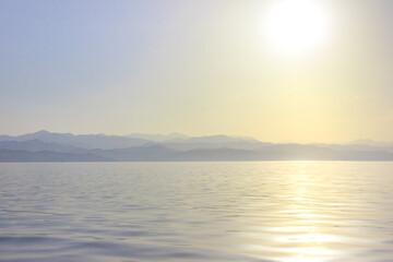 The sea at dawn. Background mrsky landscape. Calm ocean.