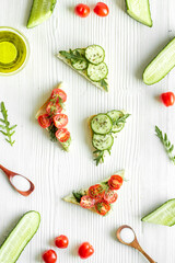 green avocado toasts on white background from above pattern