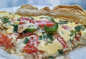 Prepare tasty piece of tarta pastry with salmon, chive and basilia.