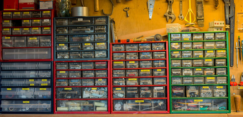 A assortment wall in a workshop (with nuts bolts screws springs nails electrics mechanics spare parts and junk)