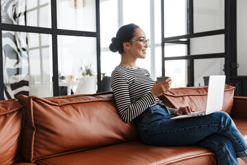 Attractive smiling young asian woman wearing casual clothes