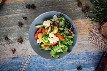 Healthy vegetables mix with greens in a bowl 