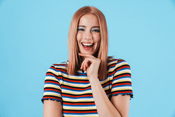 Image of young joyful woman laughing and looking at camera