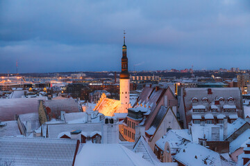 TALLINN, ESTONIA - DECEMBER 26, 2018: Roof and tower of old town. Winter panoramic aerial view by...