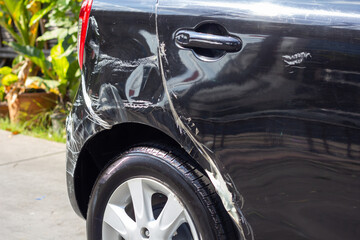 Rear of black car crash get damaged by accident on road.