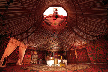 Interior of a nomadic yurt in the city of Turkestan, in Kazakhstan - obrazy, fototapety, plakaty