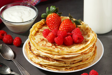 Russian cuisine national dish bliny with fresh berries
