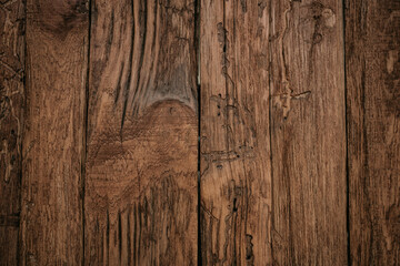 Old dark brown wooden background with vignette
