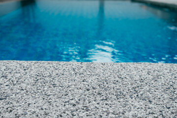 Fototapeta na wymiar Pure blue water the pool. Water caustic background