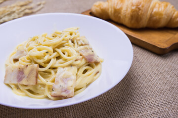 Spaghetti Carbonara on white plate.