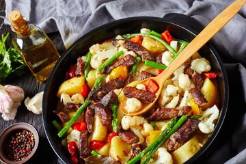 Beef strips Stew in a black ceramic pot
