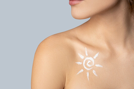 Pretty naked female with lotion sun picture on chest