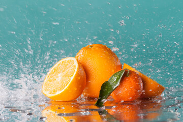 Fototapeta na wymiar Orange with water splash on background with streaming water on it.