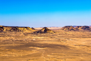 Fototapeta na wymiar It's Panoramic view of the Black desert in Egypt
