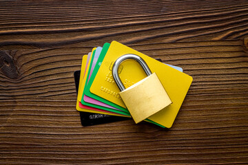 credit card with security lock on wooden desk top view