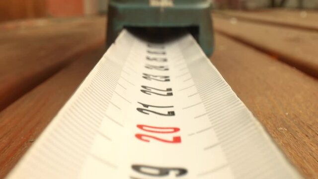 Roll of measuring tape in motion macro