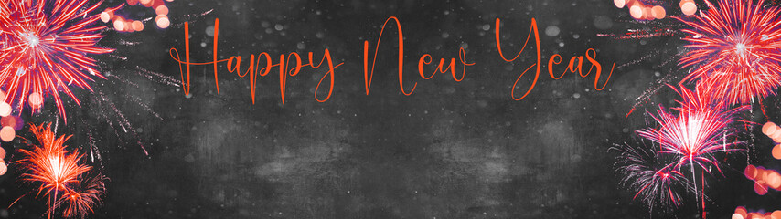 Fototapeta na wymiar HAPPY NEW YEAR Silvester background banner panorama long- Red orange golden firework and bokeh lights on dark black grey night texture, with space for text