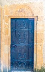 Door with cross of XII century Templar chapel in Metz, France