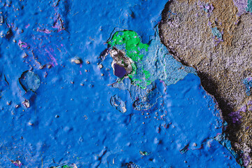 Old dirty painted wall. Several layers of blue paint. background texture. Horizontal orintation