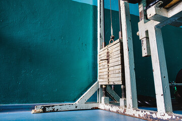 Old rusty gym equipment in strom room. Horizontal