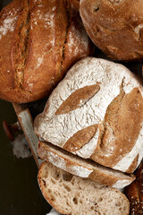 Traditional freshly baked, crusty artisan homemade sourdough bread. Top view, Healthy, clean, natural diet, back to nature concept. Copy space.