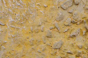 Old dirty concrete surface painted with rough polishes in different colors. background texture. Horizontal