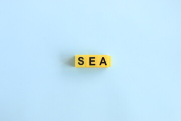 sea concept, lettering in yellow letters on a blue background