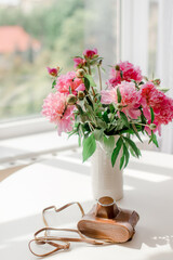 bouquet of pink peonies on a table