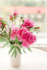 bouquet of pink peonies on a table