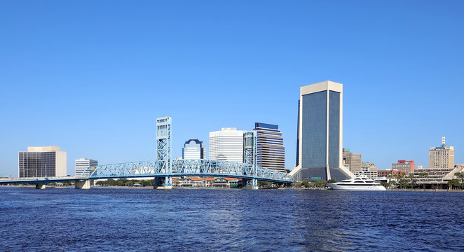Clean and beautiful Jacksonville skyline as seen from Jacksonville Riverwalk on a clear blue sky day.