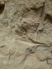 Structural earthen background with dents.