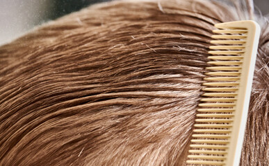 Close-up of the male hairbrush doing a haircut hair waves