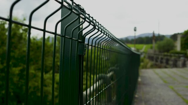 green fence with sunset background