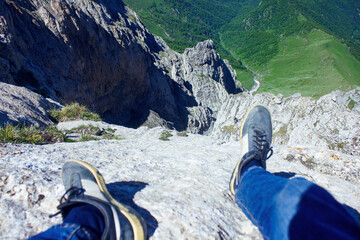climber sharp precipice from the mountain