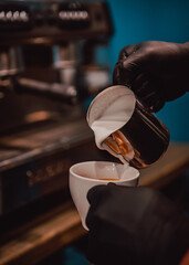 Fototapeta na wymiar Barista hand making cappuccino Coffee with espresso machine in cafe