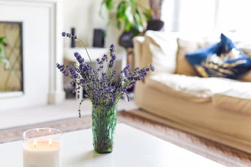 Fotobehang Modern home interior of living room with scented candle and lavender flowers on coffee table © tommoh29