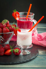 Sweet strawberry and healthy, wholesome food in composition on the table.