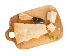 Piece of parmesan cheese on wooden board  isolated on white. Parmigiano Reggiano, hard mature...