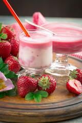 Sweet strawberry and healthy, wholesome food in composition on the table.