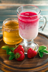 Sweet strawberry and healthy, wholesome food in composition on the table.
